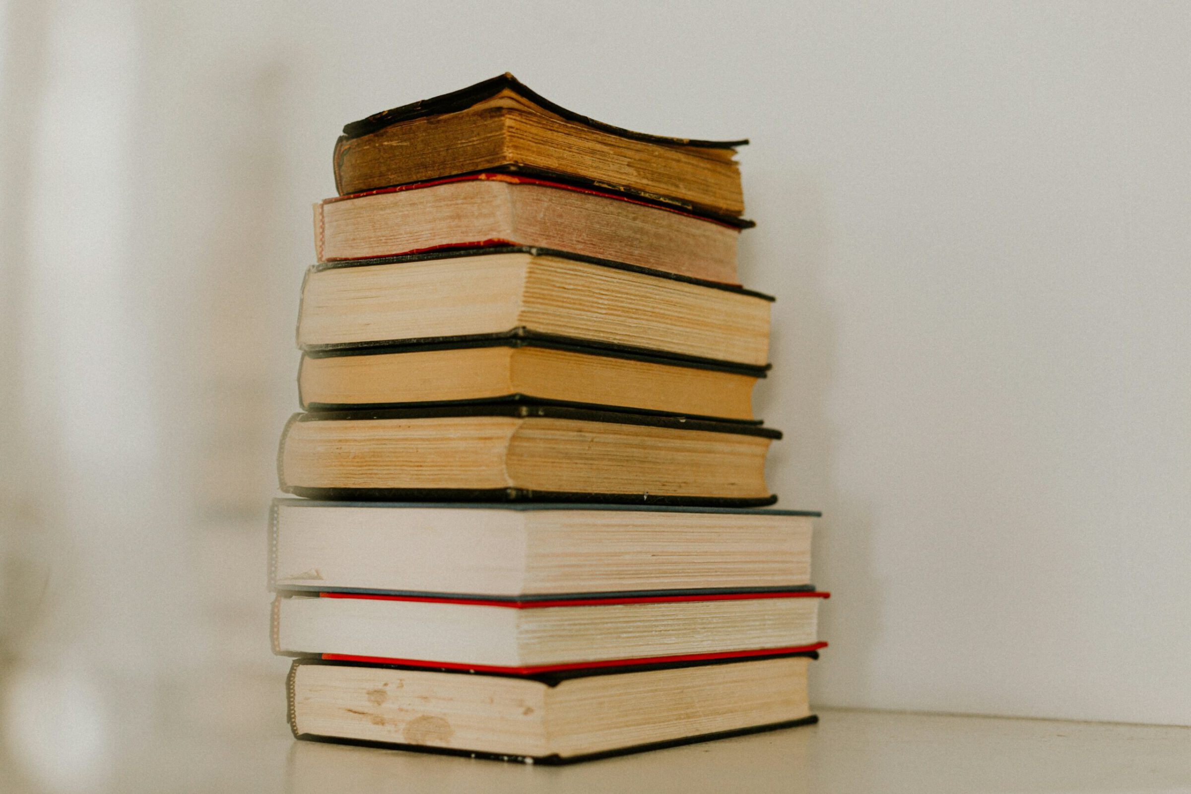 8 books stacked on top of each other