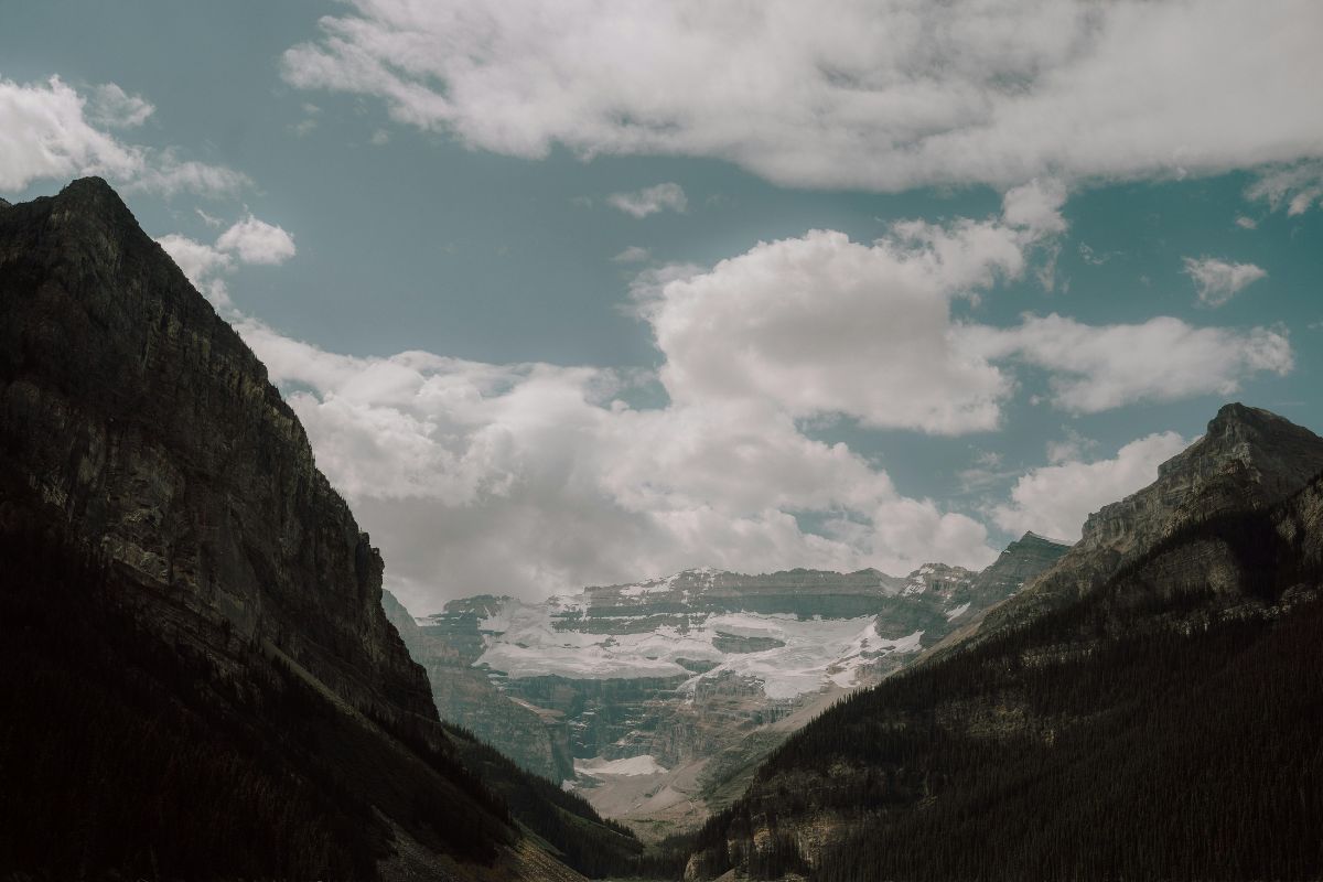 Close up shot of mountains with clouds in the sky