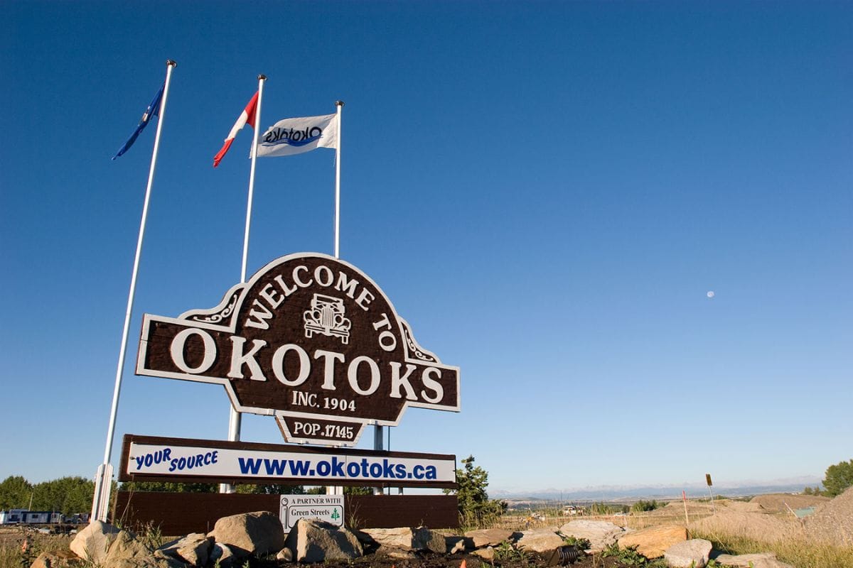 A sign reading Welcome to Okotoks