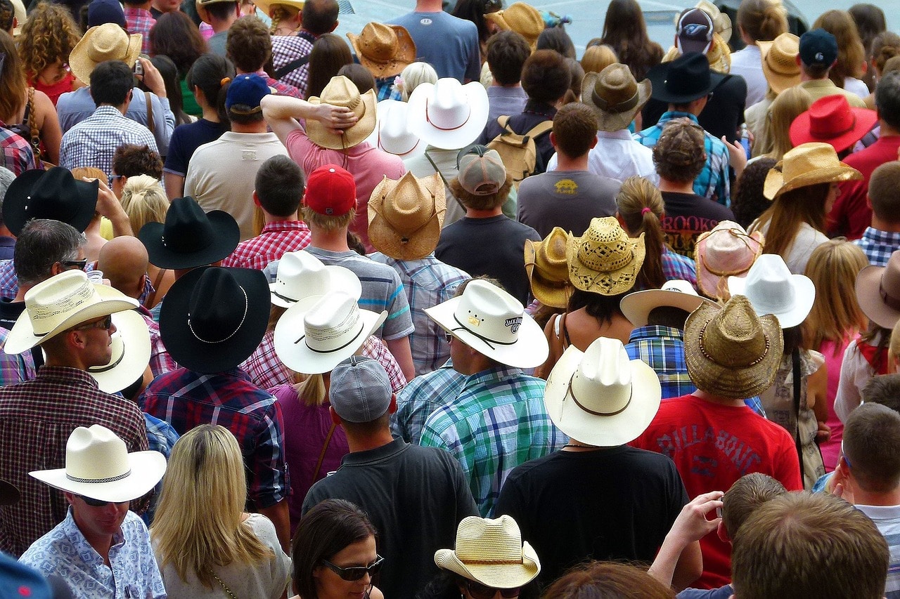A crowd of people wearing cowboy hats