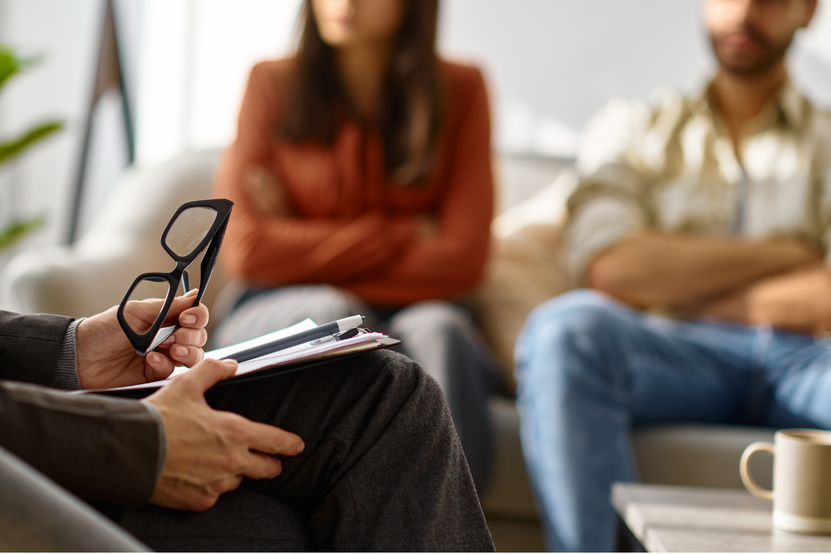 Two people meeting with a therapist